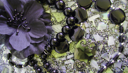 still life with jewelry and flower