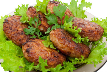 Cutlets on salad leaves