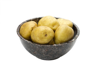 White potatoes in bowl isolated on white