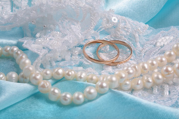 wedding rings over blue backgound