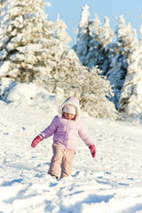 Fototapeta na wymiar little girl in winter Orlicke Mountains, Czech Republic