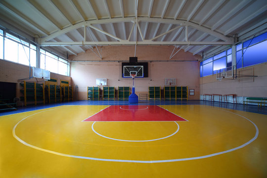 School Gym Hall With Red-yellow Floor And Basket