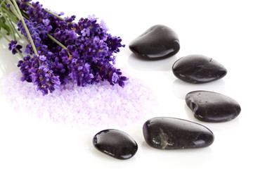 Fototapeta na wymiar black pebbles stones and lavender flowers