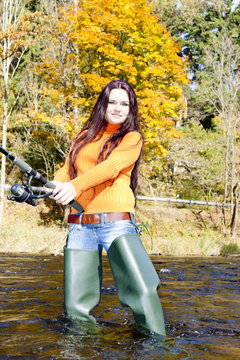 Woman Fishing In Otava River, Czech Republic