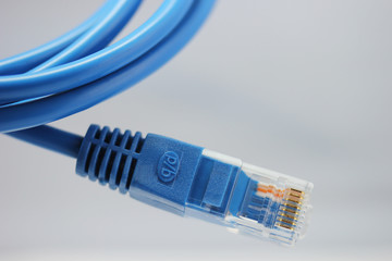 Blue computer cable from white background