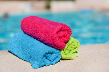 Rolled towels near the swimming pool