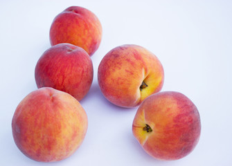Fototapeta na wymiar Ripe, juicy peaches isolated on white background