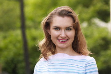 Woman smiling. Outdoor portrait