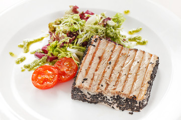 salmon steak with salad