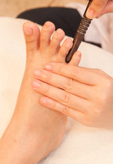 reflexology foot massage by stick wood, spa foot treatment,Thail