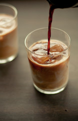 Coffee Pouring Over Milk