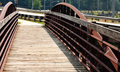 Old Wood and Rusty Metal Bridge by a Road