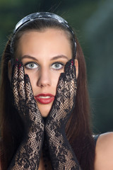 portrait of a beautiful woman with hands under chin