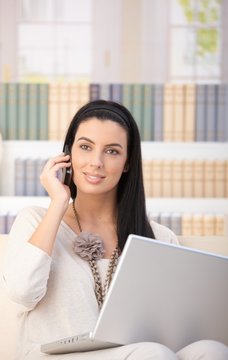 Happy woman on phone call at home