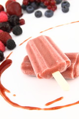Two ice pops of berries