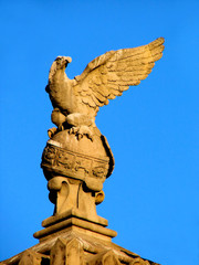 sculpture of  eagle on  sphere with zodiac signs in barcelona. s