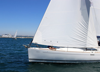 white sailing boat at sea
