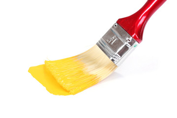 brush with bright yellow paint isolated on white