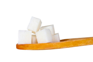 refined sugar in wooden spoon isolated on white