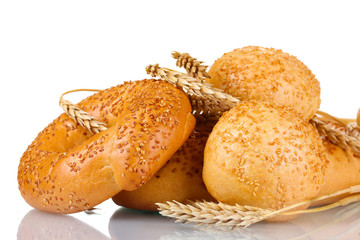 bread and buns with sesame seeds and spikelets isolated on white