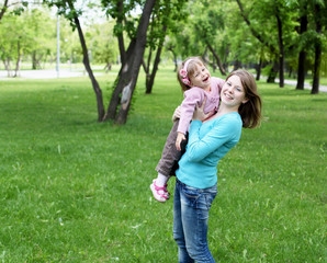 Portrait of mother with daughter outdoor