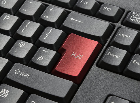 A Black Keyboard With Red Key Labelled Halt