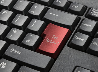 A Black Keyboard With Red Key Labelled Tax Return