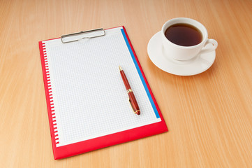 Binder with blank page and tea