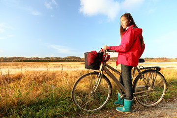 Autumn / fall woman biking