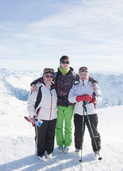 Skiers mountains in the background