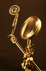 magnifying glass & gold internet symbol