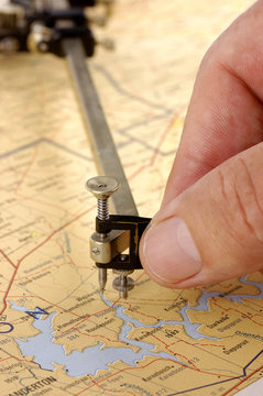 An engineer working with a Planimeter