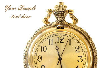 Golden antique watch against white background
