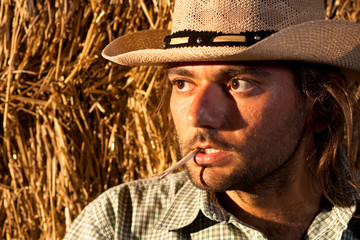 Tough Cowboy with Straw in His Mouth