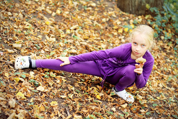 Portrait of Little Girl in Autumn Park