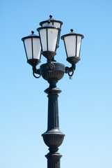 Fototapeta na wymiar street lamps on blue sky background