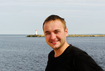 Fototapeta premium Young man at the sea.