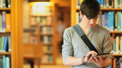 Young man with a tablet - Powered by Adobe