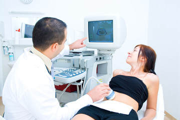 A doctor shows the results of ultrasound examination