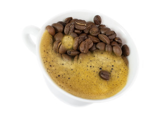Yin and Yang in a cup of coffee isolated on white