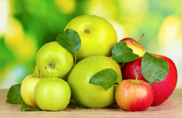 Fresh organic apples on wooden table isolated on white