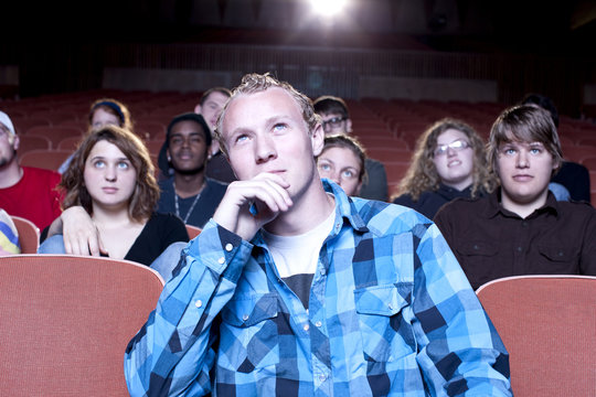 Caucasian Man Watching Movie In Theater