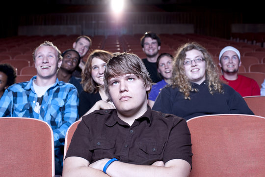 Friends Watching Movie In Theater