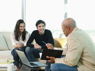 Couple talking to financial advisor