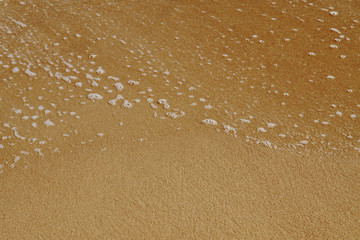 Fototapeta na wymiar Sea water over sandy beach