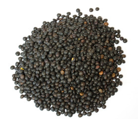 Heap of black lentil isolated on white