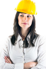 Portrait of a young engineer woman in yellow helmet