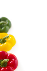 Three colorful bell pepper tops with copy space