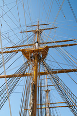 Fototapeta premium Mast sailing ship against a blue sky