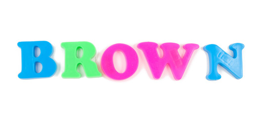 brown written in child's fridge magnets on white